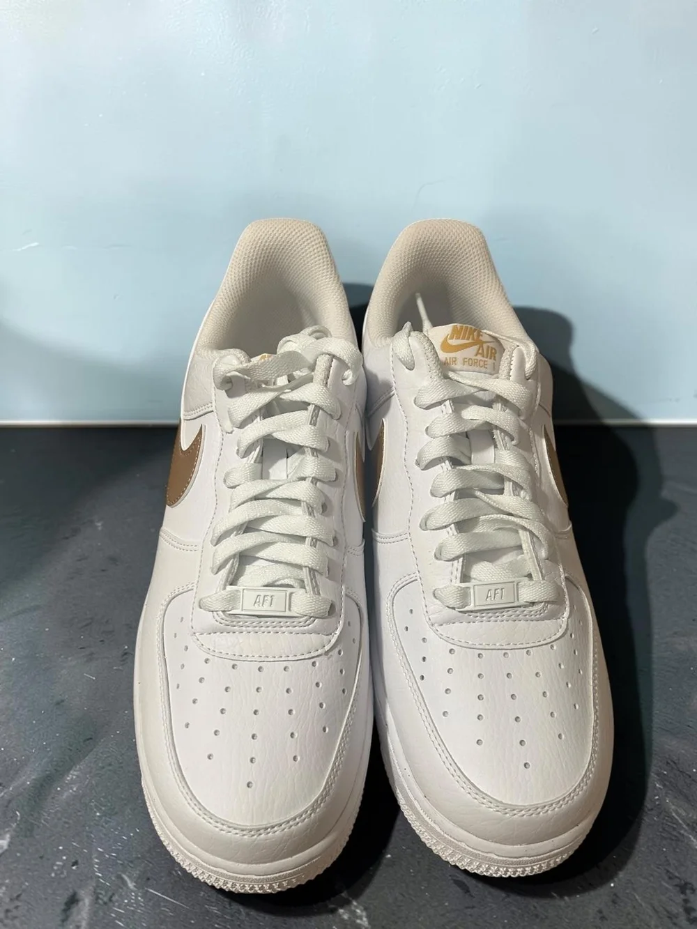 Nike Leather Low-Top Sneaker - White with Gold Swoosh